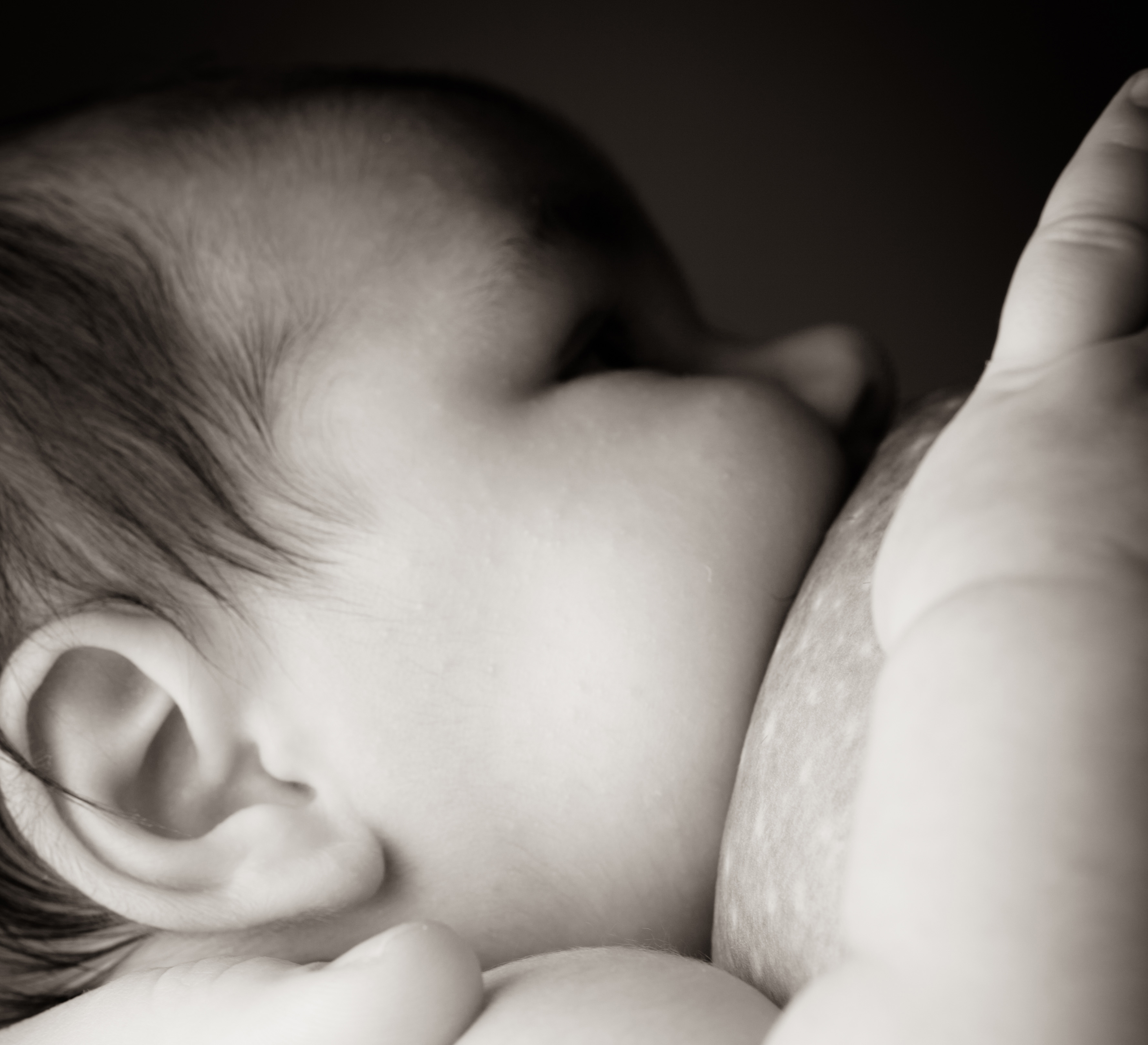 Image of a baby breastfeeding
