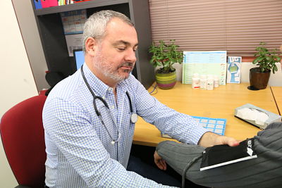 Photo of nurse taking blook pressure