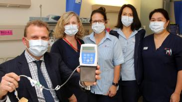 The Movement Disorder Clinic team with an infusion pump
