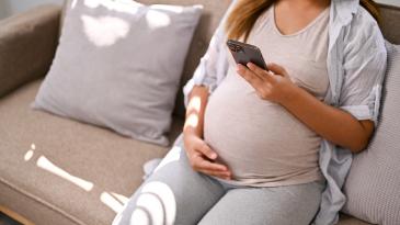 Pregnant woman on phone