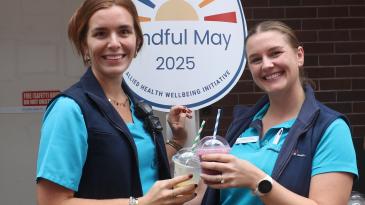 Allied Health Staff with Mindful May signage