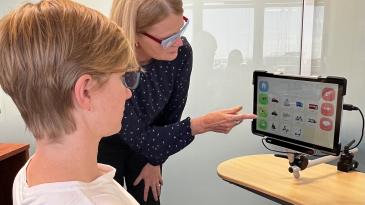 Clinician, Val Maynes showing patient CAT interface